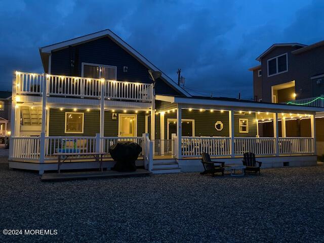 view of front of house with a balcony