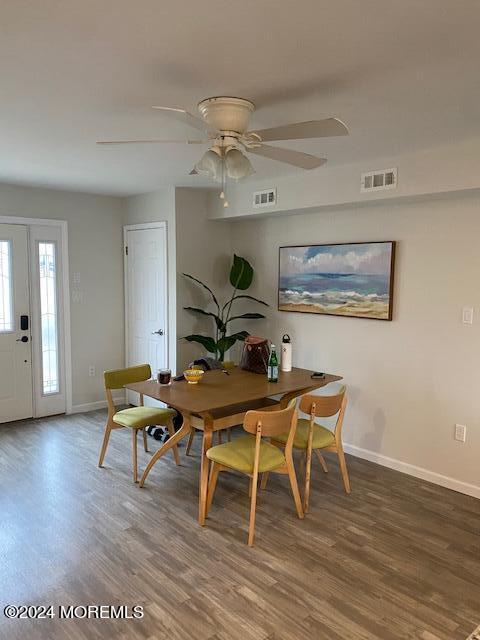 dining area featuring hardwood / wood-style floors and ceiling fan