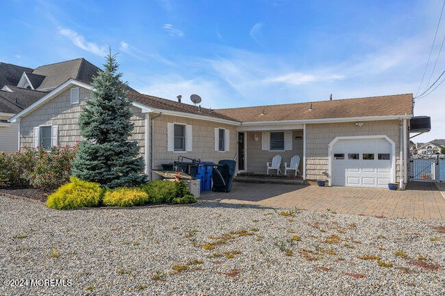 ranch-style home featuring a garage