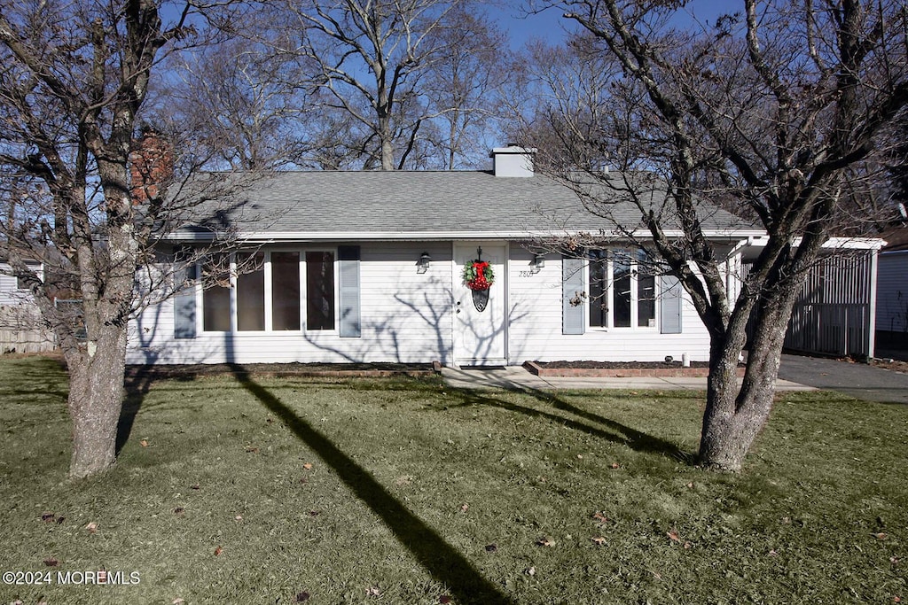 view of property exterior with a yard