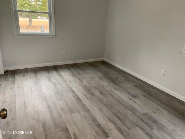 empty room featuring hardwood / wood-style flooring