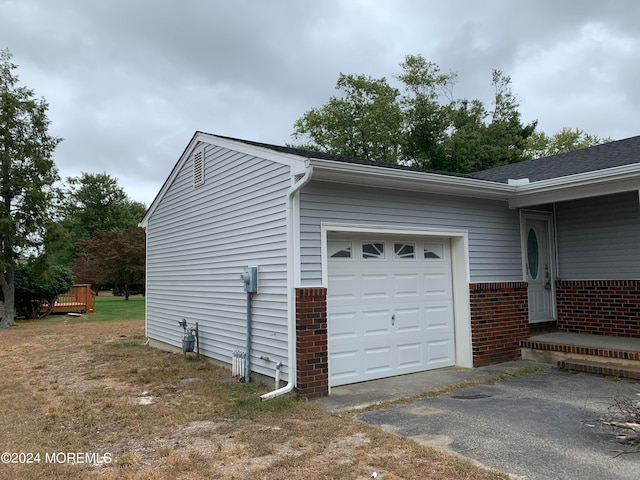 view of property exterior featuring a garage