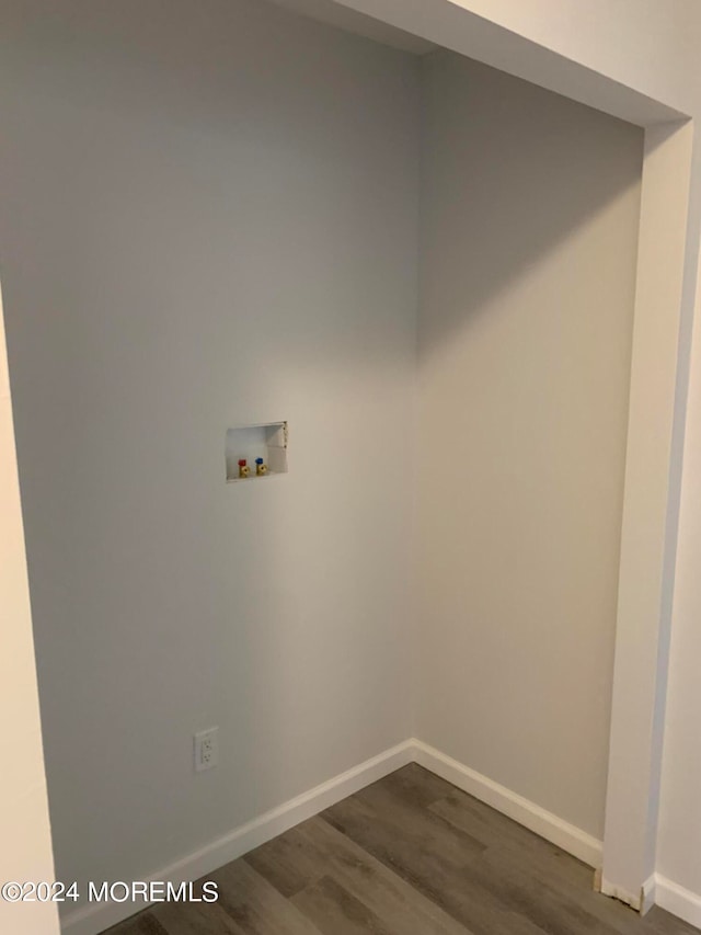 laundry area with washer hookup and dark hardwood / wood-style floors