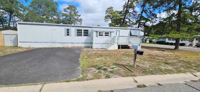 manufactured / mobile home with a shed