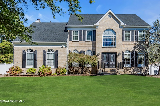 colonial home with a front yard