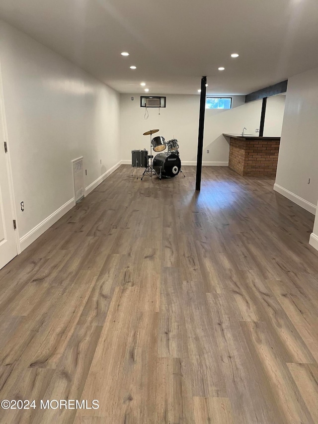 basement featuring hardwood / wood-style flooring