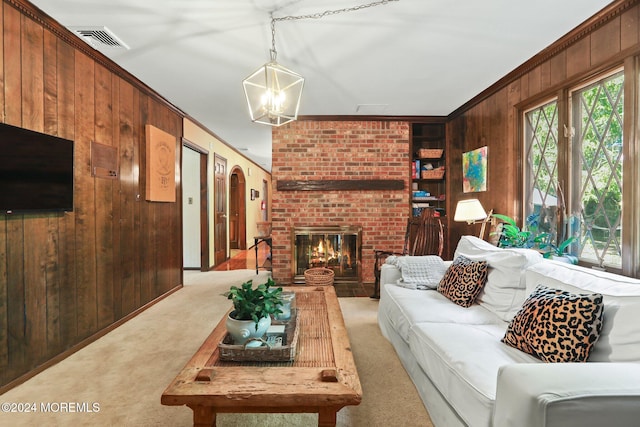 living room featuring light colored carpet, crown molding, wooden walls, and a brick fireplace