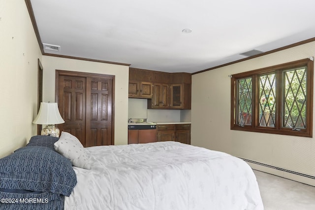 carpeted bedroom featuring a baseboard heating unit, a closet, and ornamental molding