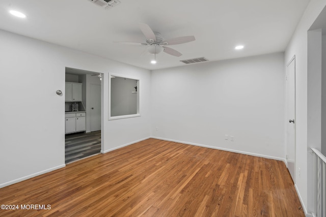 unfurnished room featuring ceiling fan and wood-type flooring