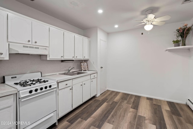 kitchen with dark wood-type flooring, white cabinets, ceiling fan, white gas stove, and sink