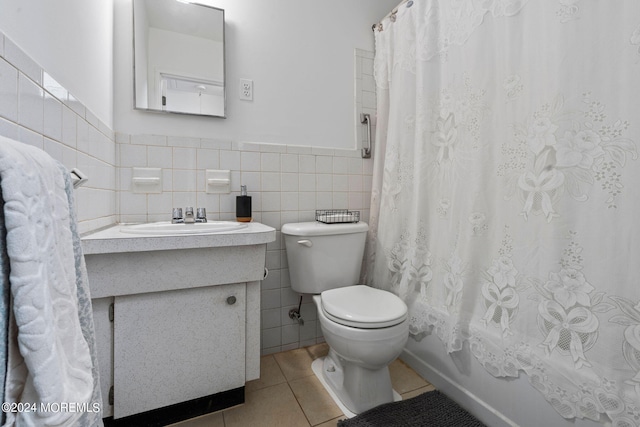 full bathroom featuring vanity, tile patterned floors, tile walls, toilet, and shower / tub combo with curtain