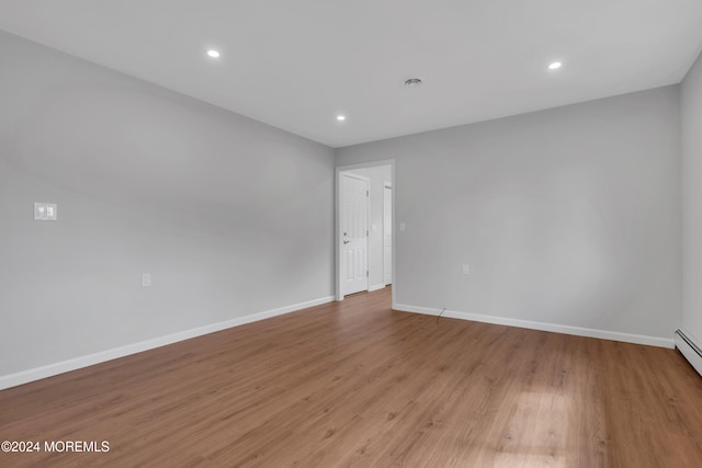 spare room with light wood-type flooring