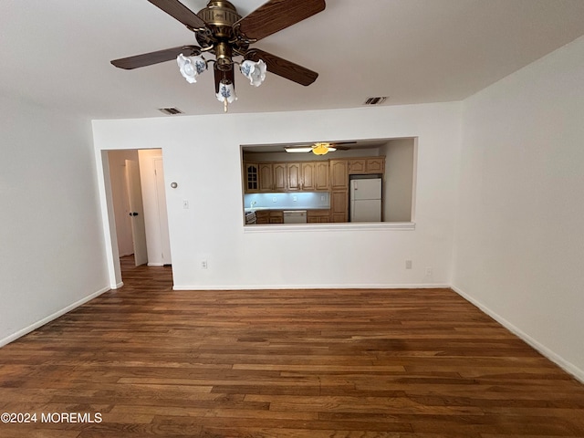 unfurnished room featuring ceiling fan and dark hardwood / wood-style flooring