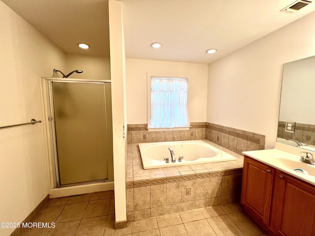 full bath with visible vents, a bath, a stall shower, and tile patterned flooring