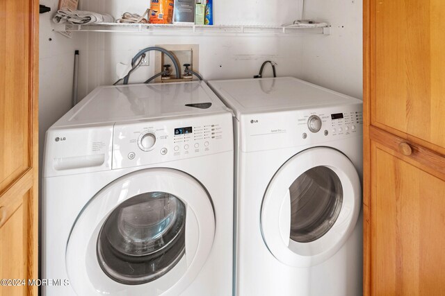 washroom featuring washer and dryer