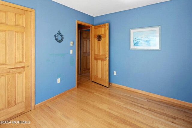 unfurnished bedroom with light hardwood / wood-style flooring