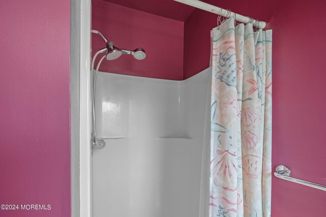 bathroom with a shower with shower curtain