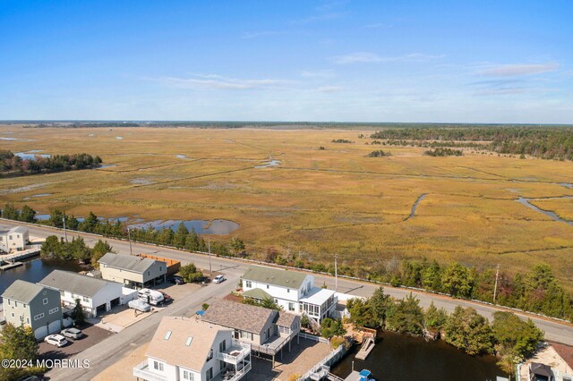 aerial view with a rural view and a water view