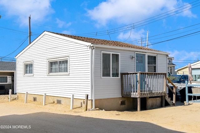 view of front of home with a wooden deck