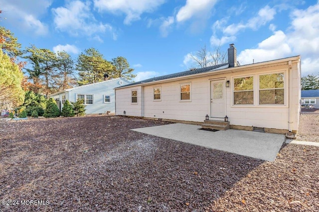 rear view of property featuring a patio