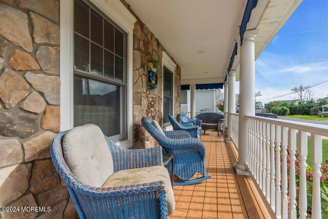 balcony featuring a porch