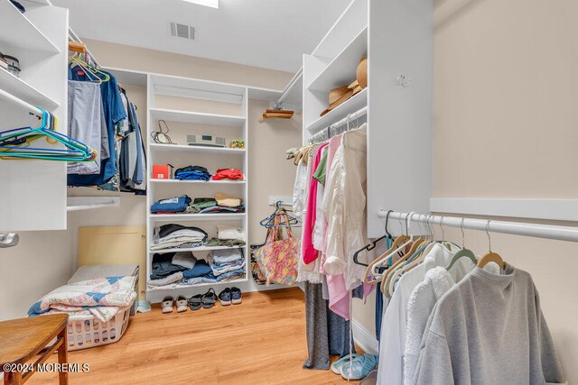 spacious closet featuring hardwood / wood-style floors