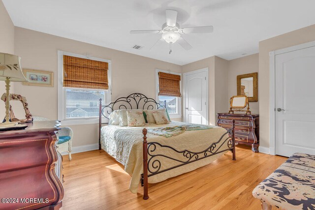 bedroom with ceiling fan and light hardwood / wood-style flooring