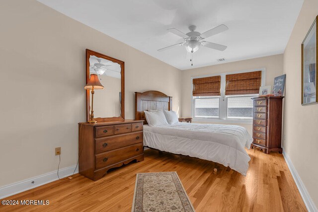 bedroom featuring light wood-type flooring and ceiling fan