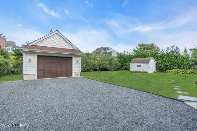 garage with a lawn