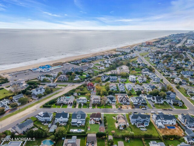 aerial view with a view of the beach and a water view