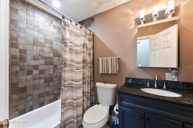 full bathroom featuring vanity, toilet, and shower / bathtub combination with curtain