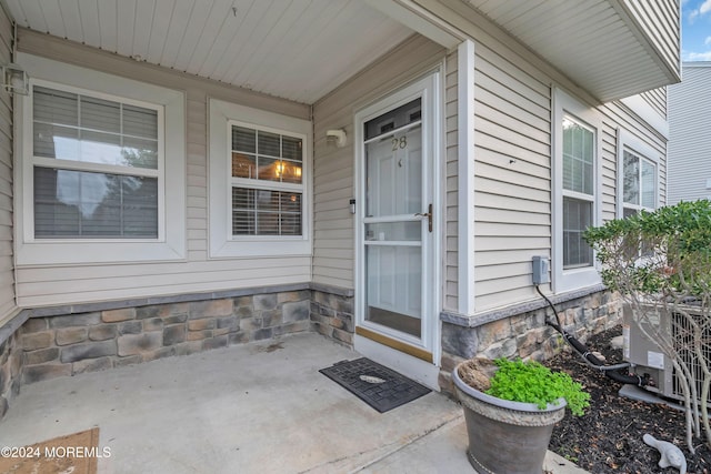 property entrance featuring cooling unit