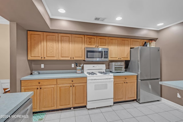 kitchen featuring ornamental molding, light tile patterned floors, and stainless steel appliances