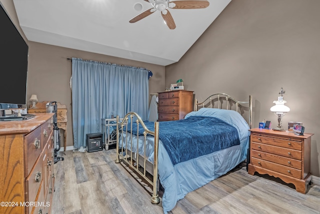 bedroom with light hardwood / wood-style floors and ceiling fan