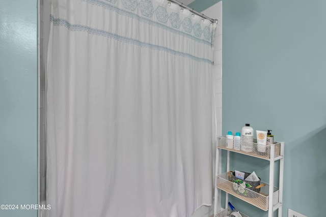 bathroom featuring a shower with curtain