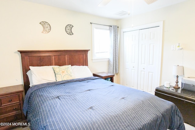 bedroom with ceiling fan and a closet