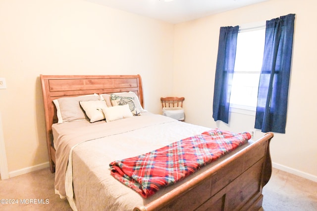 bedroom with light carpet