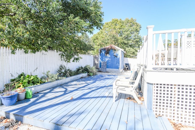 wooden terrace with a shed