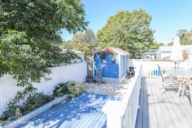 deck featuring a storage shed