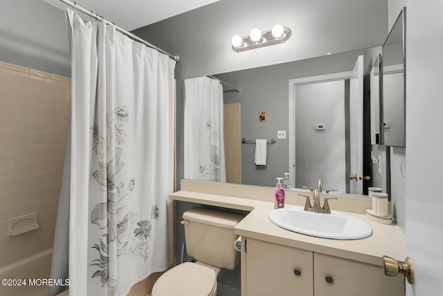 full bathroom with vanity, toilet, and shower / tub combo