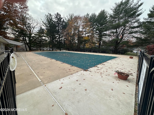 view of swimming pool featuring a patio