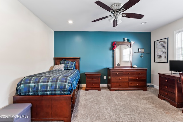 carpeted bedroom with ceiling fan