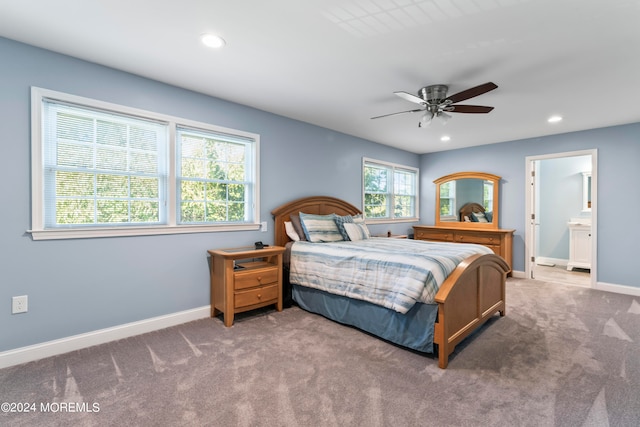 bedroom featuring ceiling fan, connected bathroom, and carpet flooring