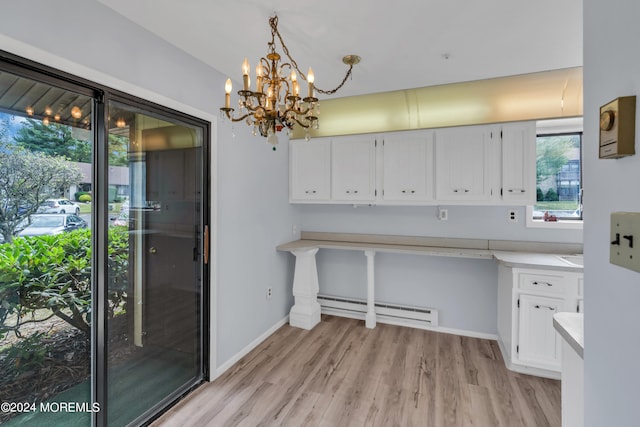 kitchen with decorative light fixtures, a chandelier, white cabinetry, a baseboard radiator, and light wood-type flooring