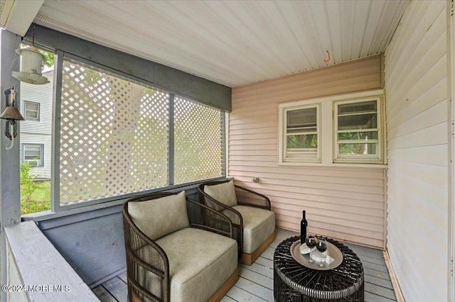 sunroom / solarium featuring wood ceiling