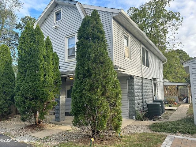 view of front of house featuring cooling unit