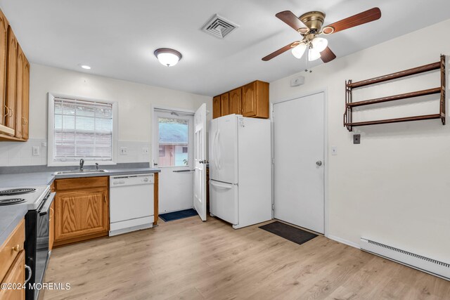 kitchen featuring light wood-type flooring, ceiling fan, white appliances, sink, and a baseboard heating unit