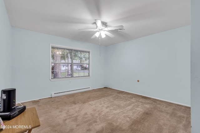 carpeted spare room with a baseboard heating unit and ceiling fan