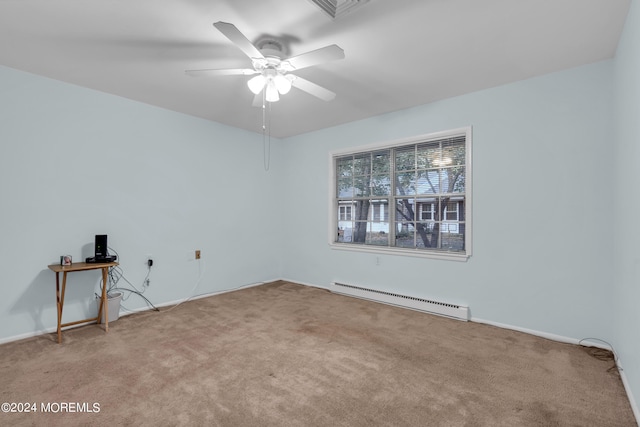 unfurnished room with ceiling fan, light colored carpet, and a baseboard heating unit