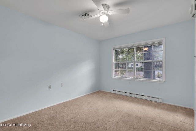 carpeted empty room with ceiling fan and baseboard heating